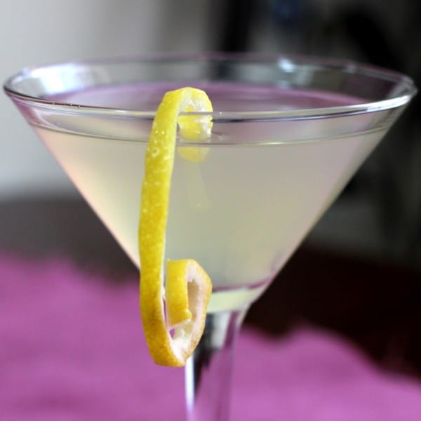 Closeup view of KGB Cocktail with lemon twist