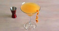 Kurant Affair drink with orange twist