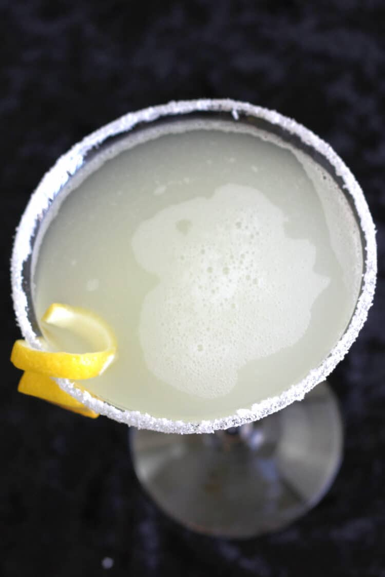 Top view of lemon drop martini with lemon twist