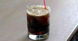 Long Black Russian cocktail served with red straw