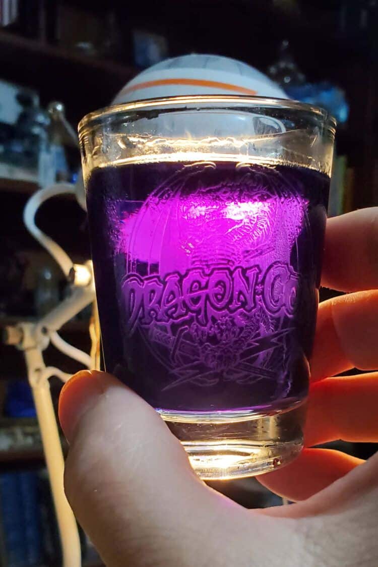 Mage's Cocktail looking purple when held in front of a lamp