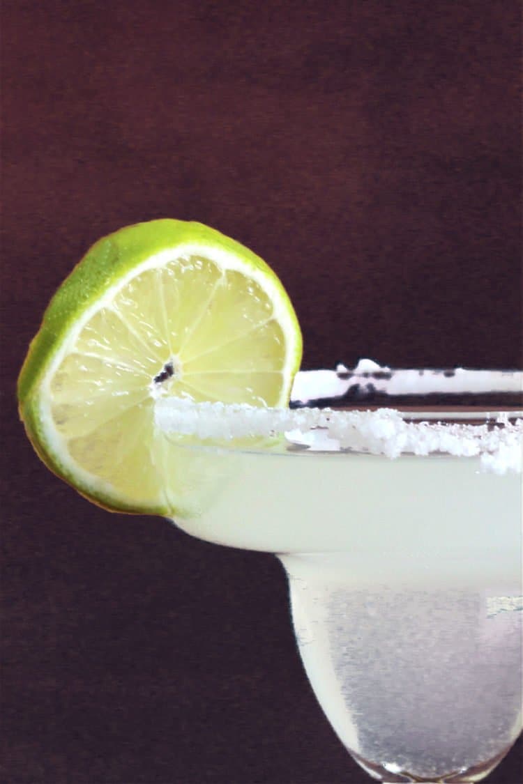 Closeup of classic margarita cocktail with lime
