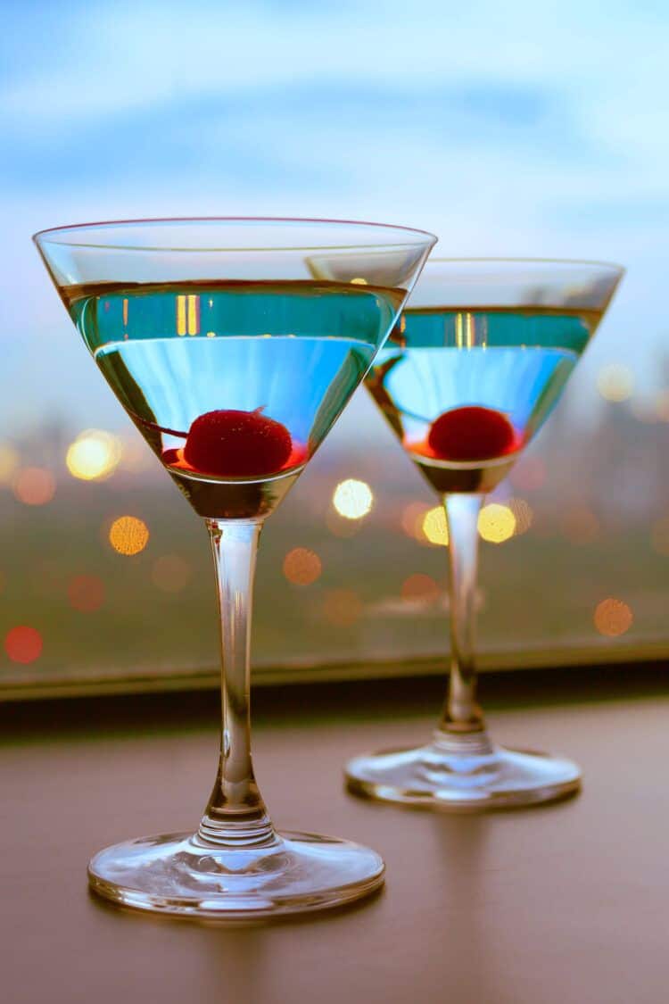 Two martinis in front of a window