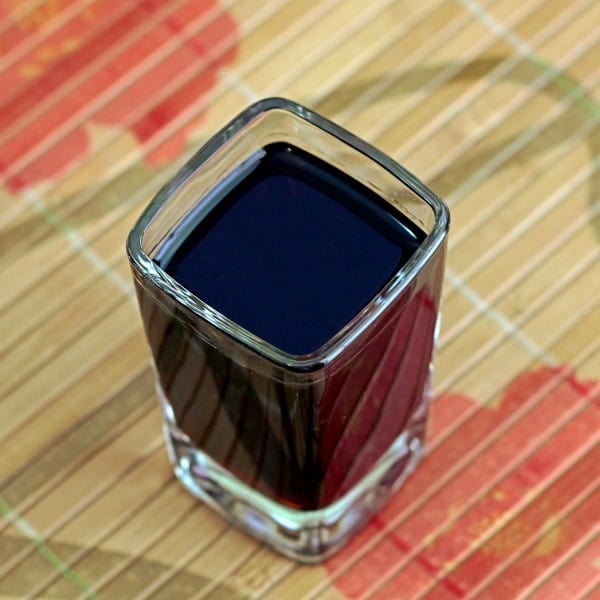 Overhead view of Midnight Oil drink in square glass