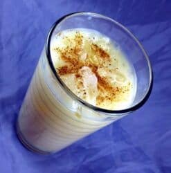 Milk Punch drink with nutmeg sprinkles