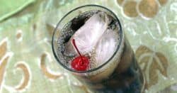 Tilted angle view of Mixy's Rum and Coke with cherry
