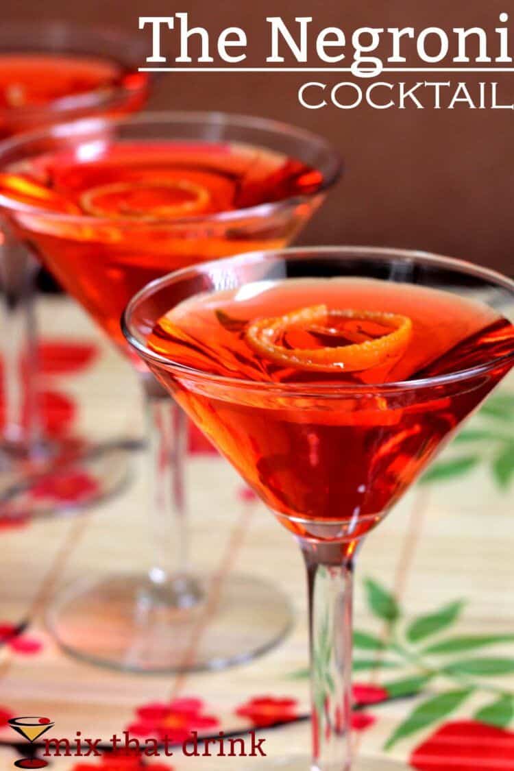 Bright red Negroni cocktails with orange twists