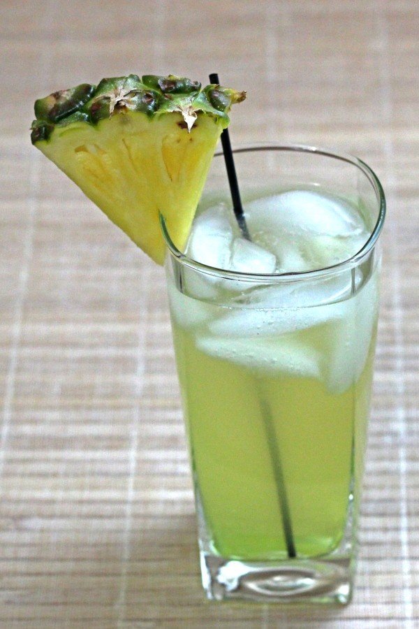Oh My God cocktail with pineapple wedge