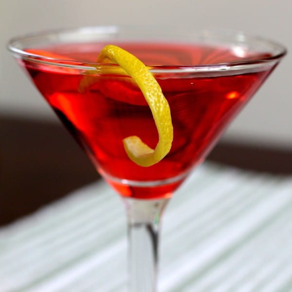 Closeup view of Pacifist cocktail with lemon twist