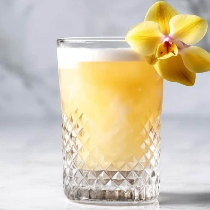 Pearl Diver cocktail garnished with an edible orchid