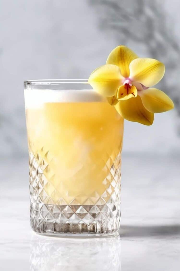 Pearl Diver cocktail garnished with an edible orchid