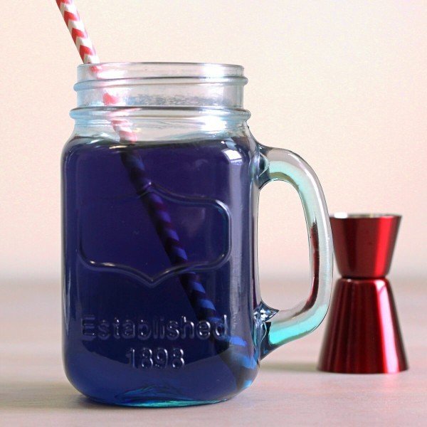 Closeup of the deep dark blue of the Prison Blues cocktail