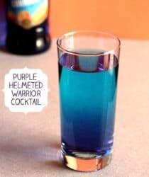 Purple Helmeted Warrior drink in front of liquor bottle