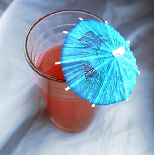 Purple Passion drink with cocktail umbrella