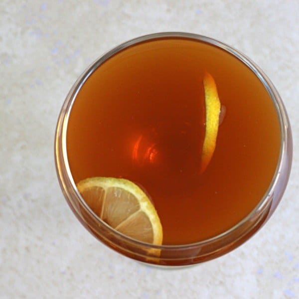 Overhead view of R.A.F. Cocktail with lemons on cutting board