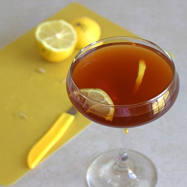 Angled view of R.A.F. Cocktail garnished with lemon slices