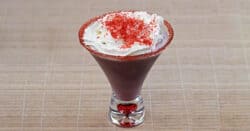 Raspberry Beret drink with whipped cream and red sprinkles on top