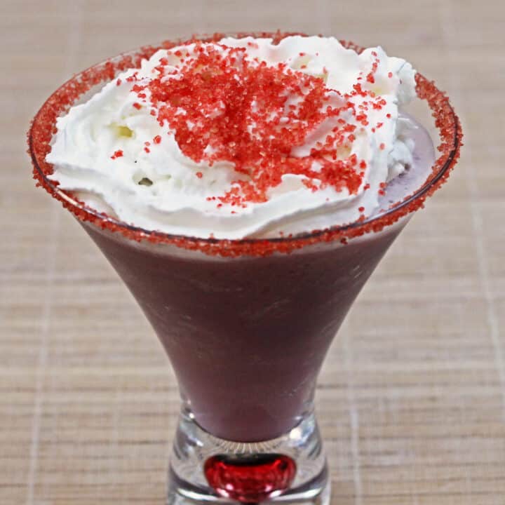 Raspberry Beret drink with whipped cream and red sprinkles on top