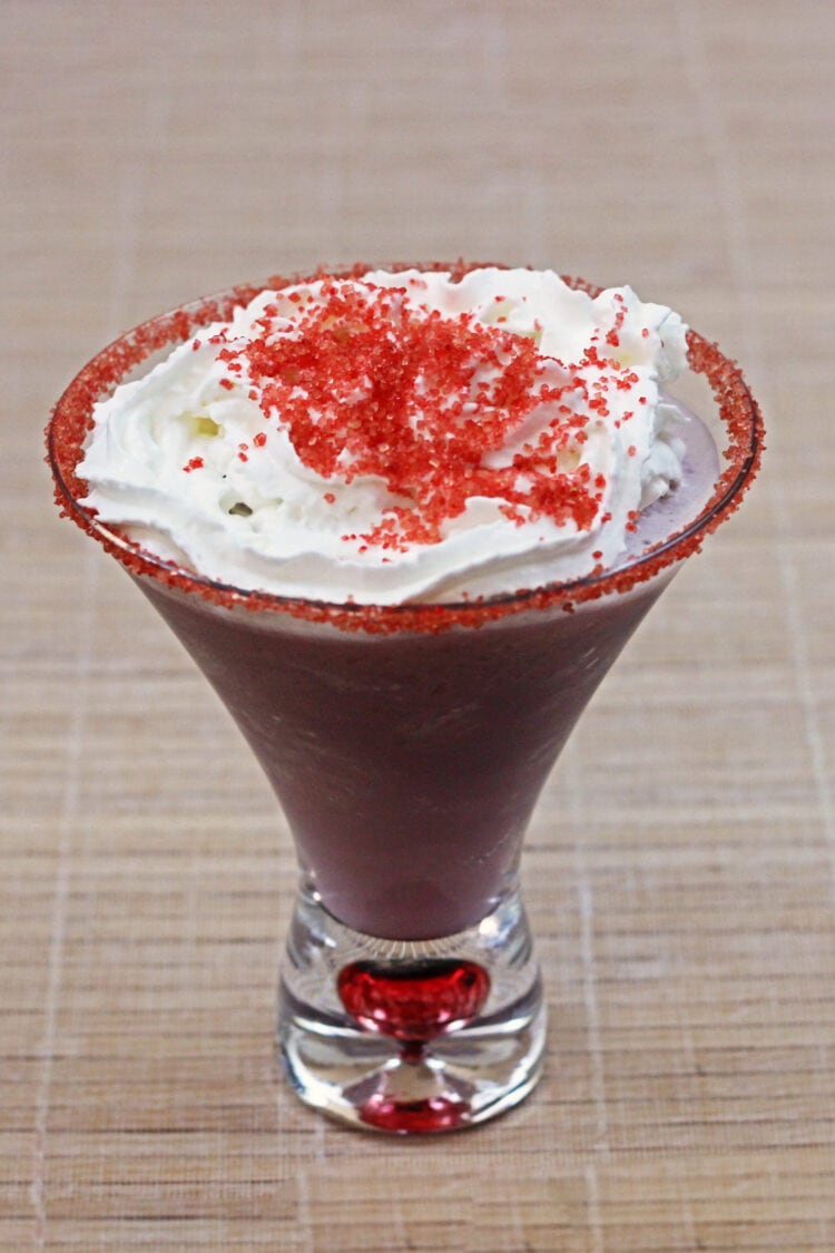 Raspberry Beret drink with whipped cream and red sprinkles on top