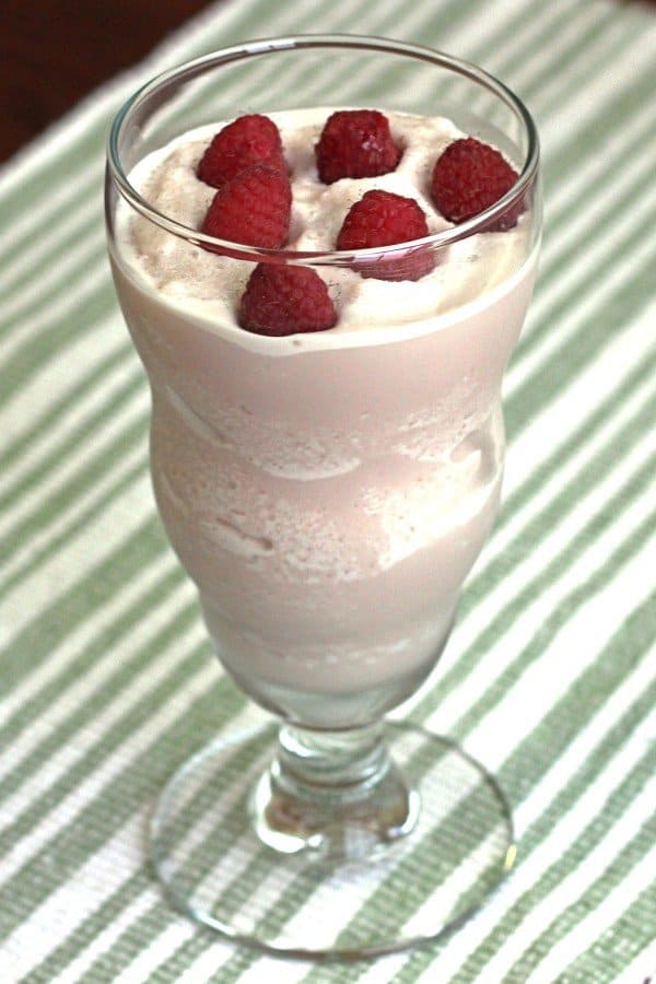 Raspberry White Chocolate Cheesecake drink with raspberries floating on top