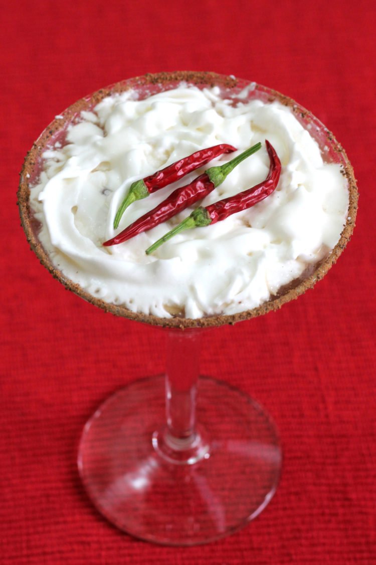 Red Hot Santa Tini with whipped cream and a chili powder cocoa rim