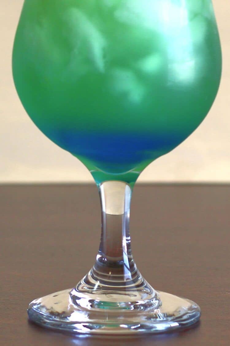Closeup of Shamrock Juice cocktail showing blue layer at bottom.