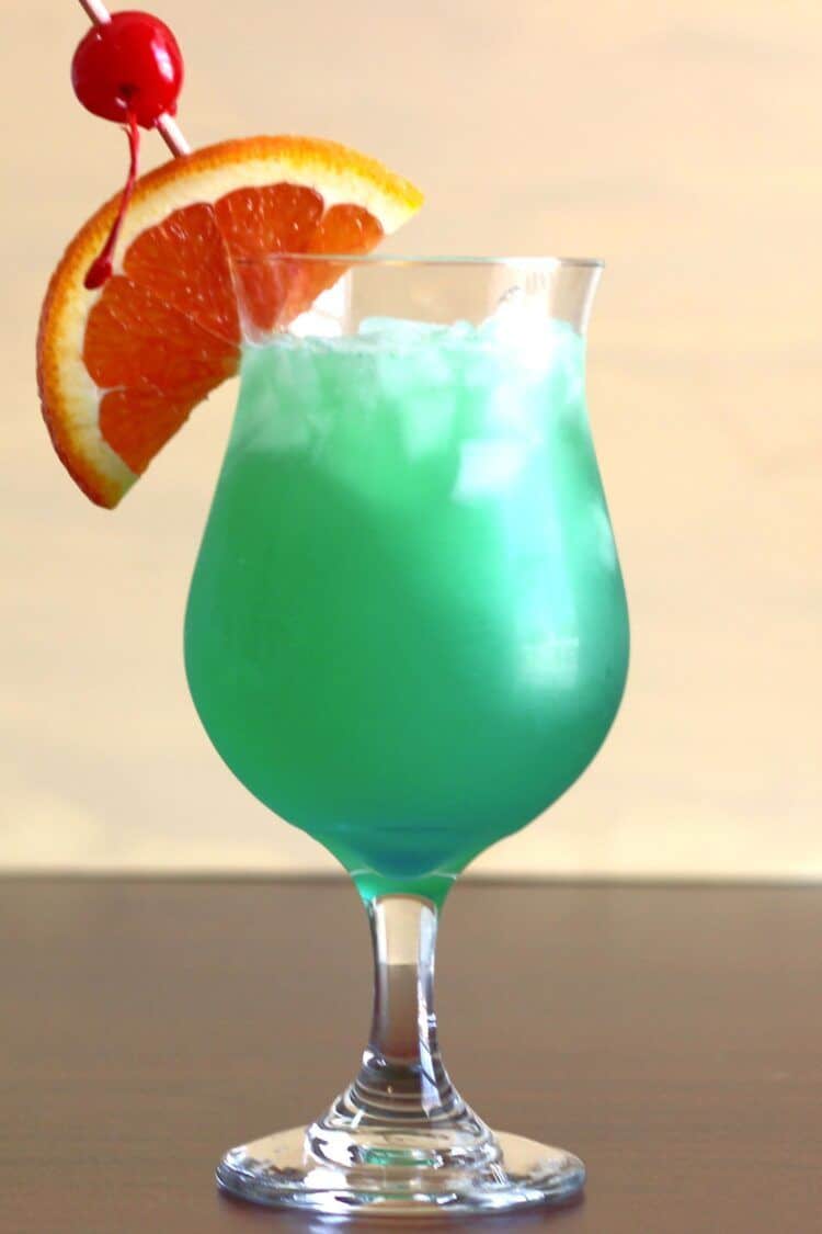 Solid green Shamrock Juice cocktail after the blue layer was stirred in