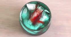 Overhead view of Shark Bite cocktail in rocks glass with ice