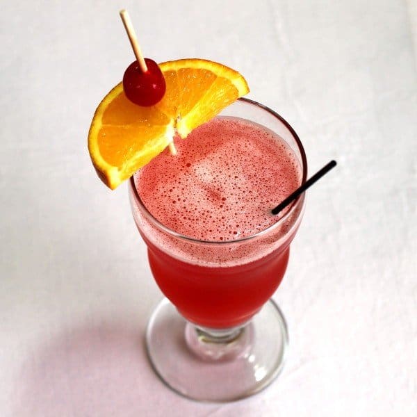 Overhead view of Singapore Sling drink with pineapple