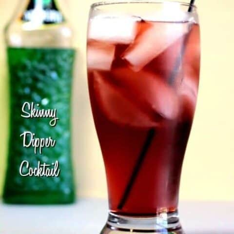 Skinny Dipper Cocktail next to liquor bottle