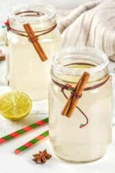 Snowball cocktail in mason jar with cinnamon sticks