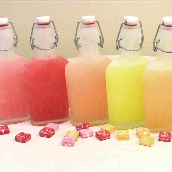 Finished, chilled Starburst Vodka Infusions in their frosty flasks