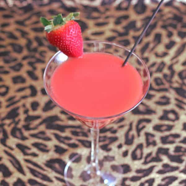 Overhead view of Strawberry Sombrero cocktail with strawberry on rim