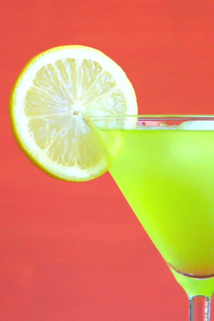 Green Super Bowl drink with lime garnish