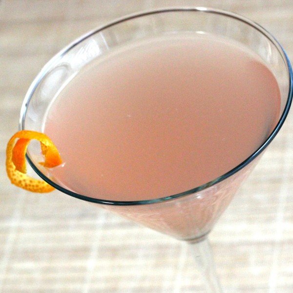 Tilted angle view of Ten Strike cocktail with orange twist