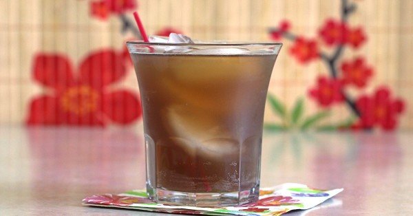 Tennessee Tea drink served on cocktail napkin with red straw