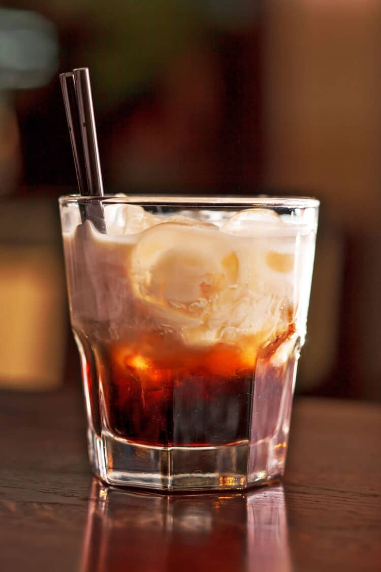 Tiatip cocktail with ice and straw in rocks glass