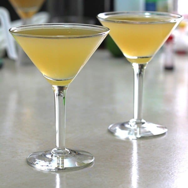 Overhead view of Tiger Juice cocktail on table backlit by window