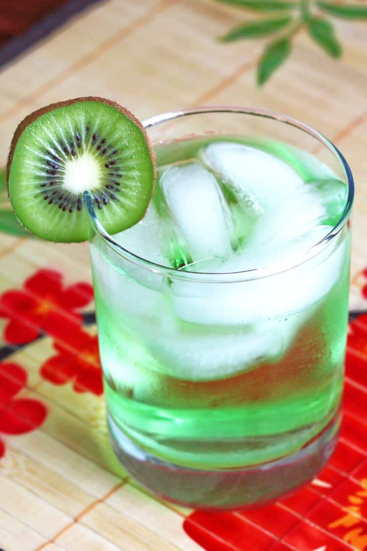 Light green Tokyo Iced Tea drink with kiwi slice garnish