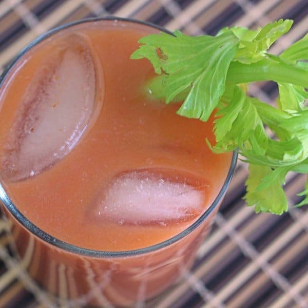 Overhead view of Tomato Lassi with celery garnish