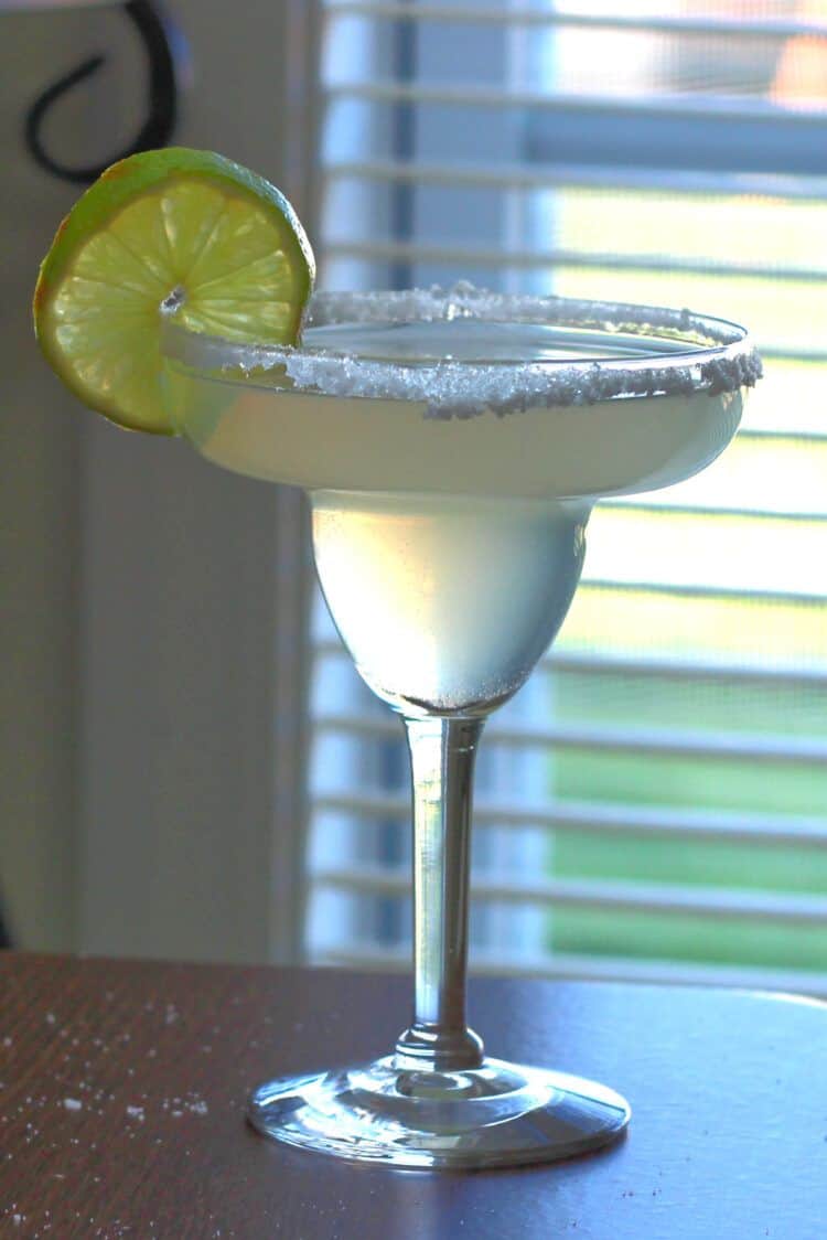 Margarita made with triple sec in front of window