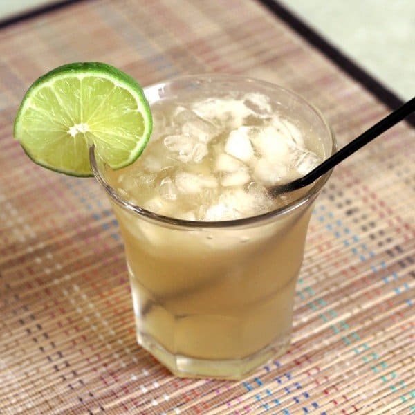 Angled view of Venus Rum cocktail with lime wheel