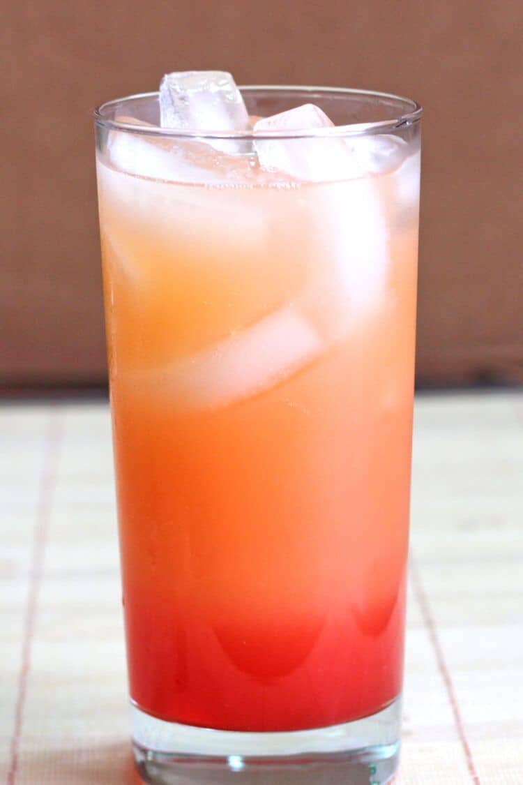 Vodka Sunrise drink in tall glass with ice