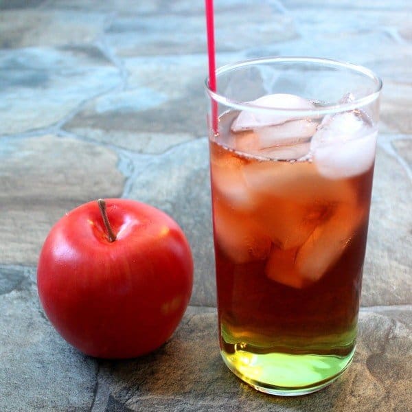 Washington Apple Cocktail in tall glass beside apple