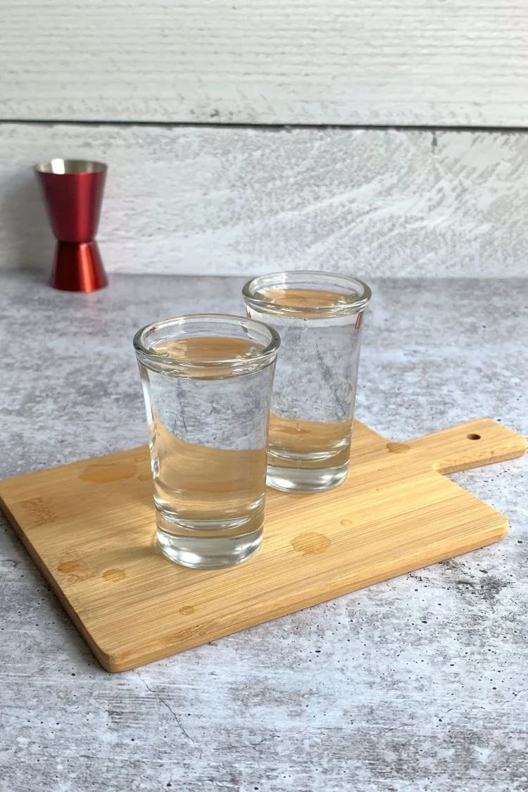 Vodka shots on a cutting board